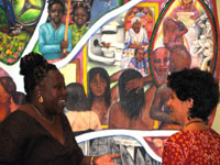 Beth Sauhaft, chatting in front of the mural